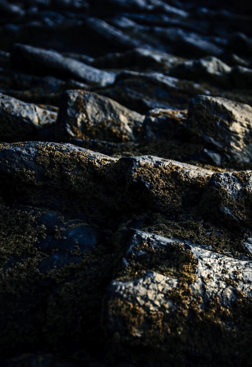 textured, rock, solid, no people, full frame, backgrounds, rock - object, close-up, nature, pattern, day, selective focus, rough, outdoors, focus on foreground, beauty in nature, detail, water, high angle view