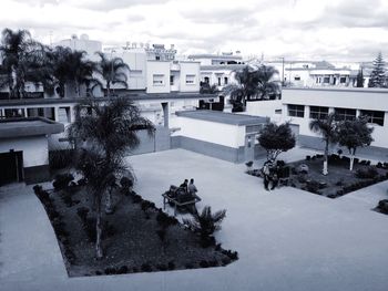 Buildings against cloudy sky