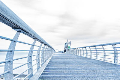 Footbridge against sky