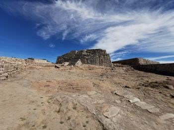 Low angle view of rock formations against sky