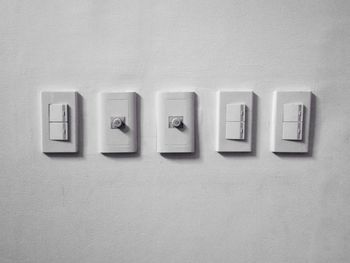 Close-up of light switch on wall