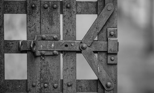 Close-up of padlock on metal door