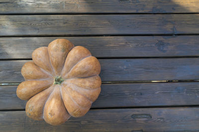 Directly above shot of pumpkin on wooden table