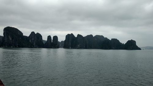 Panoramic view of sea and rocks against sky