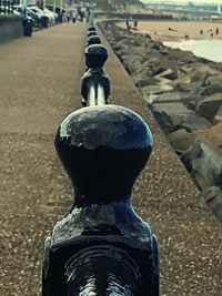 Close-up of statue against water