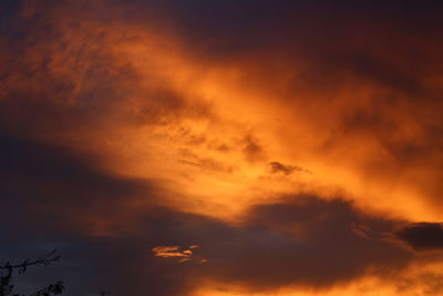 Low angle view of dramatic sky during sunset