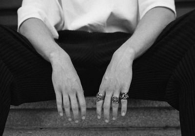 Midsection of man sitting on floor