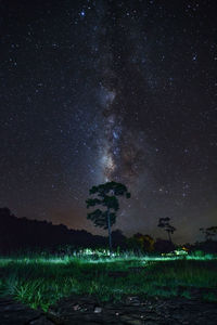 Scenic view of field against sky at night