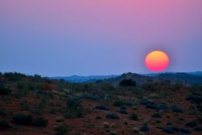 Scenic view of mountains against sky during sunset