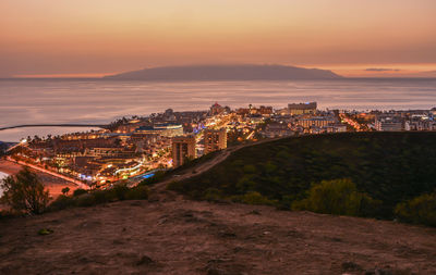 Illuminated cityscape at night