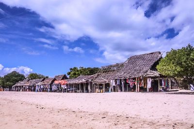 Panoramic view of beach and houses against sky