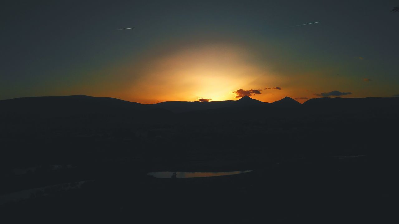 SCENIC VIEW OF SILHOUETTE LANDSCAPE AGAINST SKY AT NIGHT