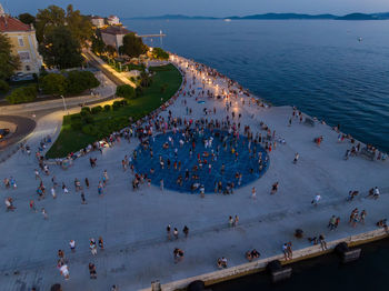 High angle view of townscape by sea