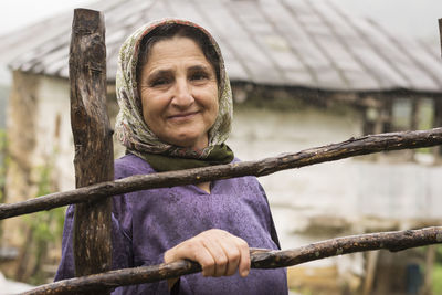 Portrait of a smiling young woman outdoors