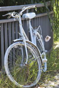 Close-up of bicycle wheel on field