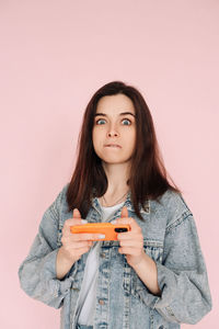 Portrait of young woman using mobile phone