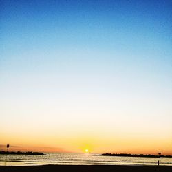 Scenic view of calm sea at sunset