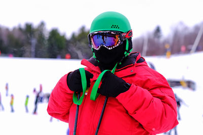 Close-up of man standing on snow