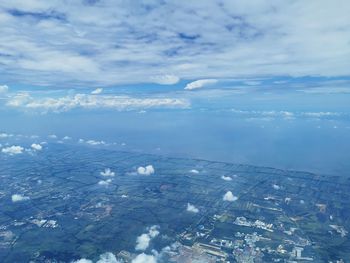 Aerial view of city and buildings against sky