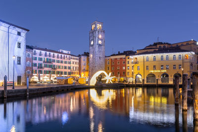 Bridge over river with buildings in background