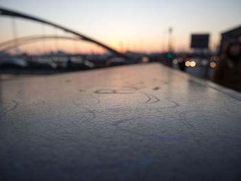 Close-up of road against sky during sunset