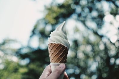 Close-up of hand holding ice cream