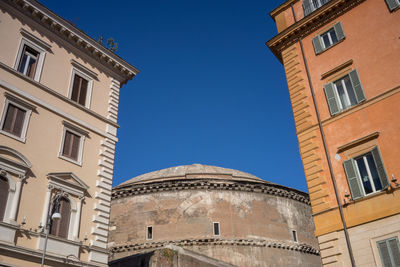 Low angle view of building against clear blue sky