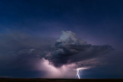 Lightning from a distant storm illuminates the night sky near buffalo, south dakota.