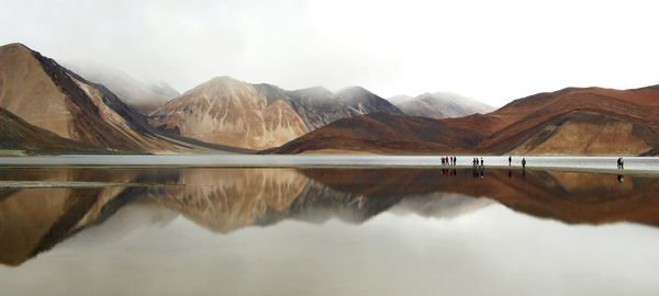 Panoramic view of lake and mountains against sky