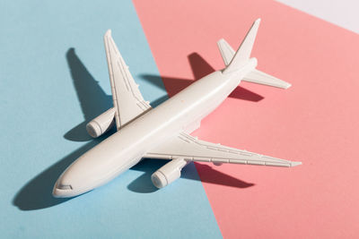 Close-up of airplane against blue background