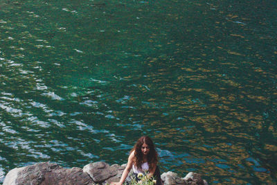 Portrait of a young woman in water