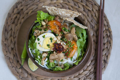 Vietnamese noodle - my quang, vietnamese traditional cuisine, noodles in bowl on the table 