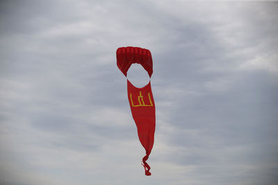 Low angle view of flag against sky