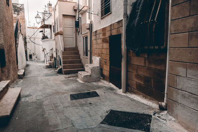 Alley amidst buildings in city