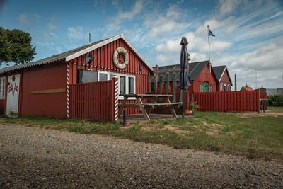 Exterior of house on field against sky