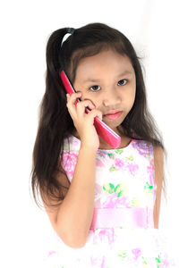 Portrait of a smiling girl over white background