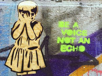 Close-up of graffiti on wall