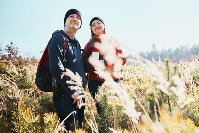 Couple enjoying nature while vacation trip. active leisure time close to nature