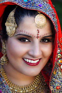 Portrait of smiling young woman in traditional clothing
