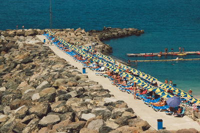 High angle view of people by sea