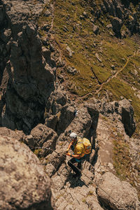 High angle view of people on rock