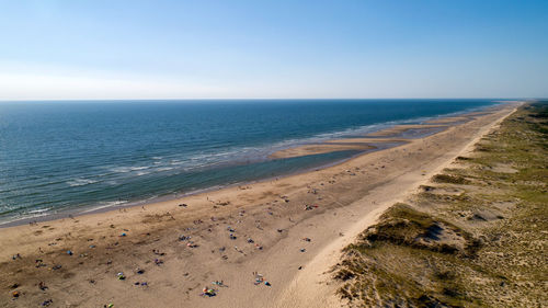 Scenic view of beach against clear sky