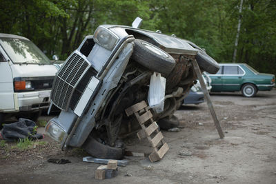 Abandoned car on field