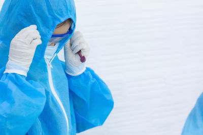 Portrait of a girl holding blue umbrella