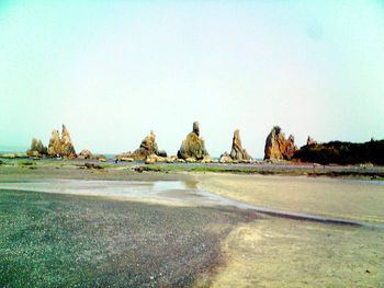 Scenic view of calm sea against clear sky
