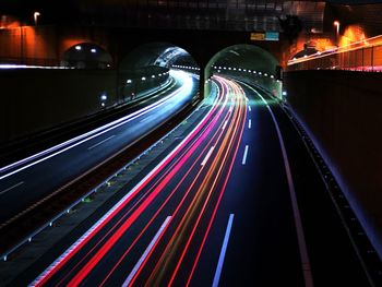 High angle view of light trails on road at night