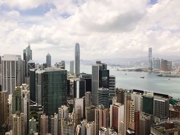 View of skyscrapers against cloudy sky