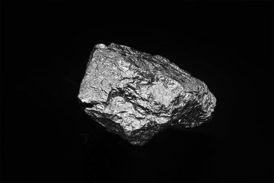 Close-up of rock against black background