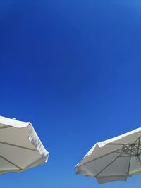 Low angle view of building against clear blue sky