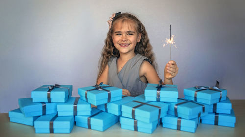 Portrait of young woman playing with toy blocks